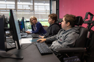 Treloar's students speaking to a teacher.