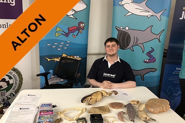 A student at his internship in an Aquarium.
