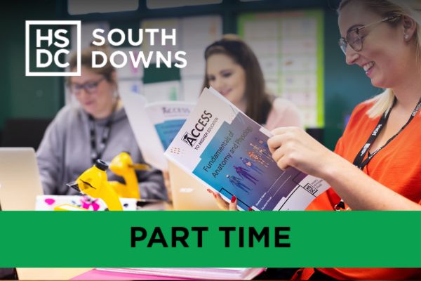 Access to Higher Education students reading a book on Anatomy for their healthcare course.