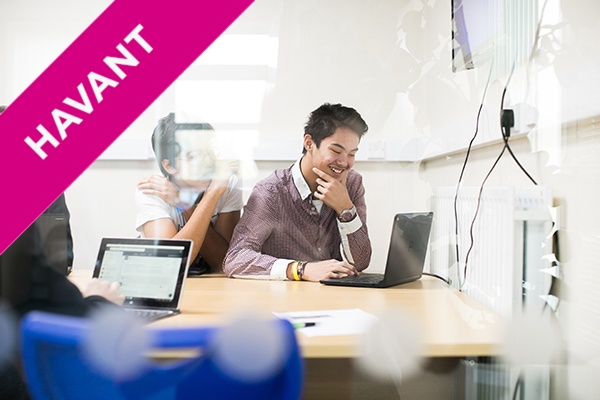 a level computer science student on a laptop in class.