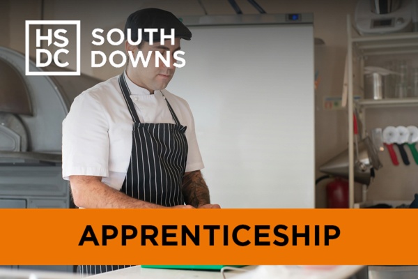 a chef working on a green chopping board.