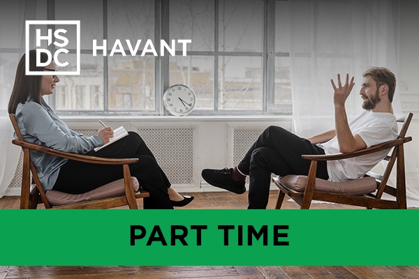 two people sat opposite each other in a counselling session