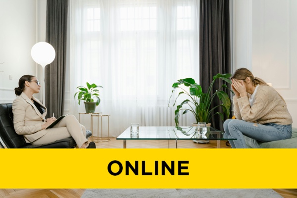 two people sat opposite each other in a counselling session