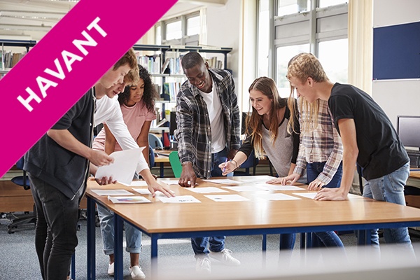 students collaborating around a table