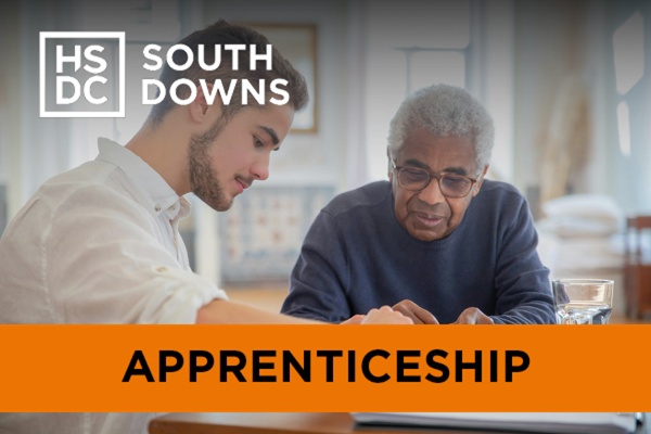 An adult care worker helps an elderly gentleman.