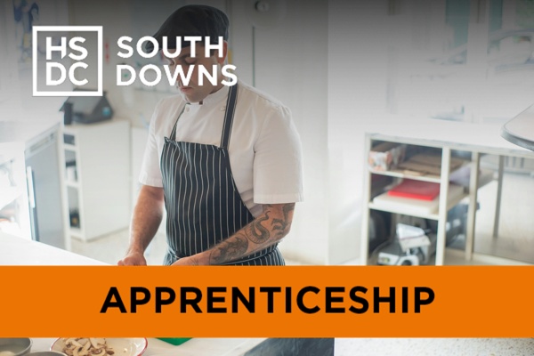 a chef working on a green chopping board.