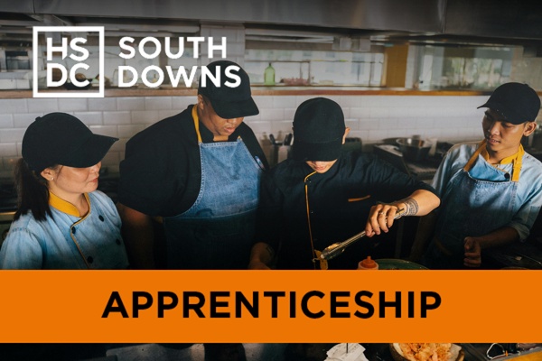 A food and beverage team working on a dish together.