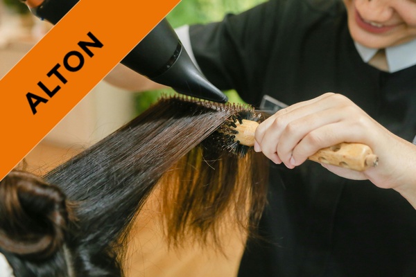 a closeup of a student styling hair