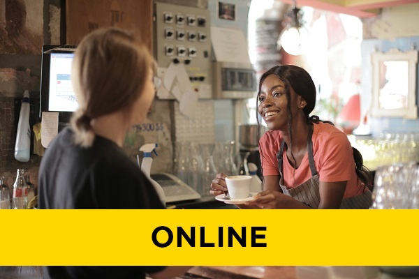 a women serving a customer their coffee