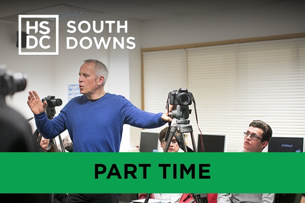 A lecturer leading a on DSLR cameras.