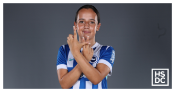 Student footballer Libby Hester poses in front of a studio background.