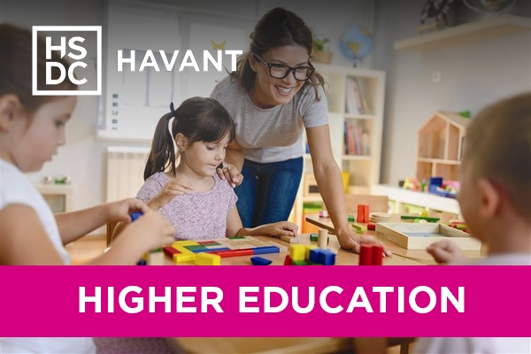 A woman playing with children in daycare.