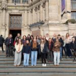 A group of students pose outside the Victoria & Albert Museum.