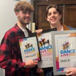 Two Dance students holding up Dance Live awards.