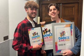 Two Dance students holding up Dance Live awards.