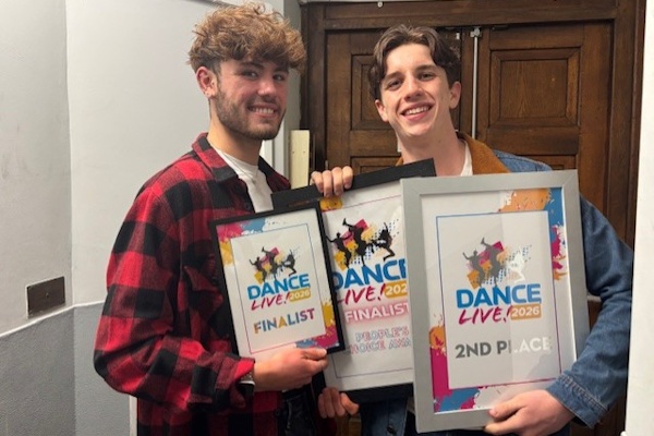 Two Dance students holding up Dance Live awards.