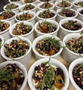 Plates of food prepared by HSDC students for the headteacher's dinner.