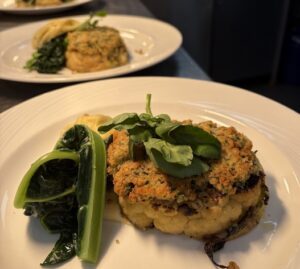 Plates of food prepared by HSDC students for the headteacher's dinner.