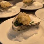 Plates of oysters prepared by HSDC students for the headteacher's dinner.
