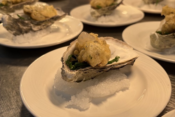 Plates of oysters prepared by HSDC students for the headteacher's dinner.